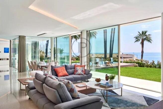 Modern living room with large glass windows, offer