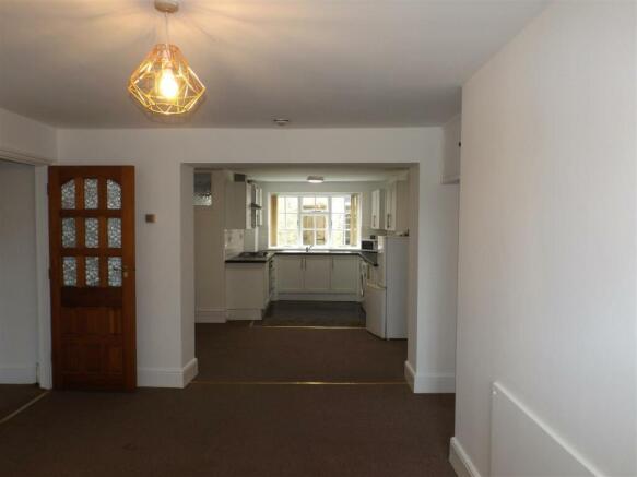 Living area to kitchen-dining area