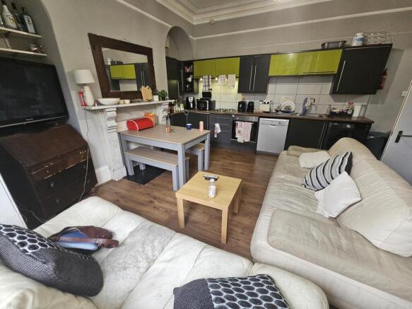 A bright and welcoming living room featuring co...