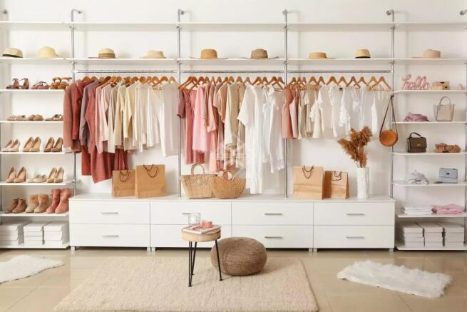 Interior of show room with stylish clothes and acc