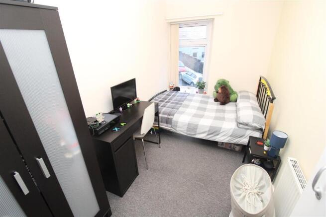 Bright double bedroom with study desk and stora...