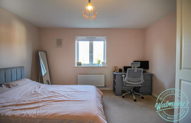 Bedroom two with attractive rear views