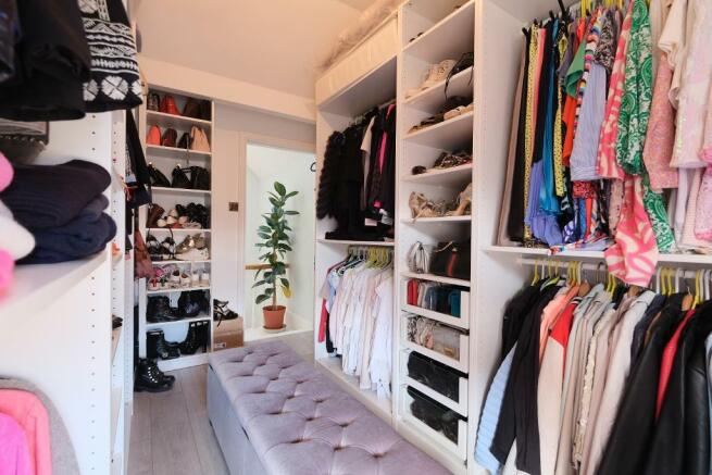 Bed 4 used as a large walk-in wardrobe