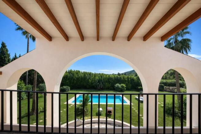 Balcony view over pool and garden