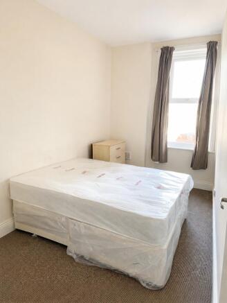 Bright bedroom with new bed and natural light...