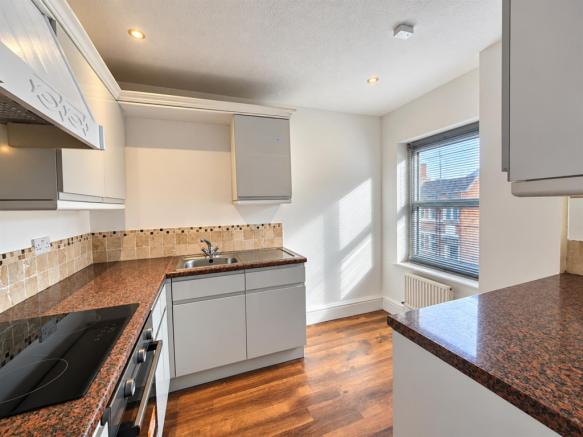 Bright Modern Kitchen with Sunlit Blinds.png