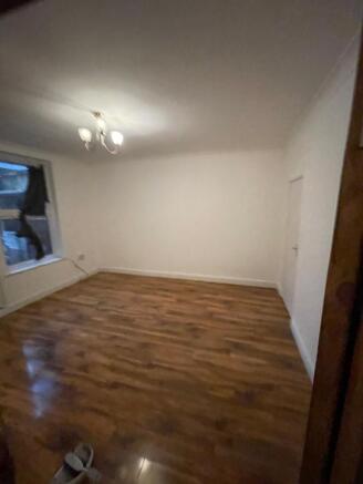 A spacious living room with ample natural light...