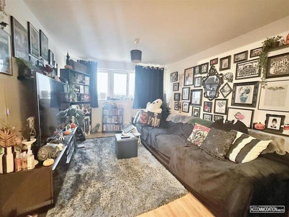 Social living area with large sofa and characte...
