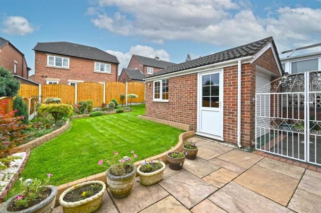 Rear Garden and detached garage.jpg