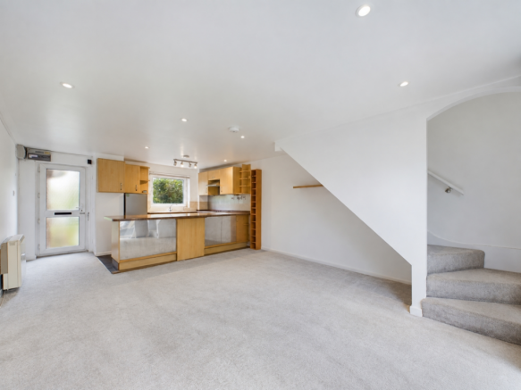 Bright empty kitchen and dining room