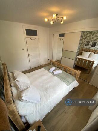 Bedroom 1 With King Size Bed And Walk In Storage