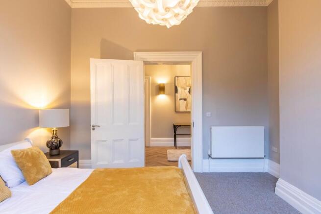 Bright, neatly presented bedroom with a double ...