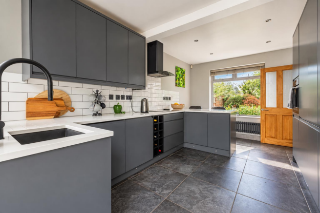 Modern Charcoal Kitchen with Garden Views.png