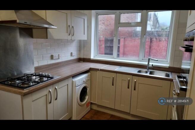 Kitchen With Gas Hob And Appliances