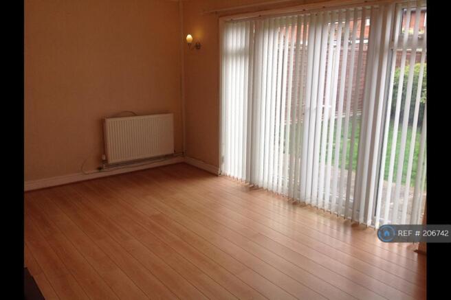 Lounge With Access To Rear Garden Via Double Doors