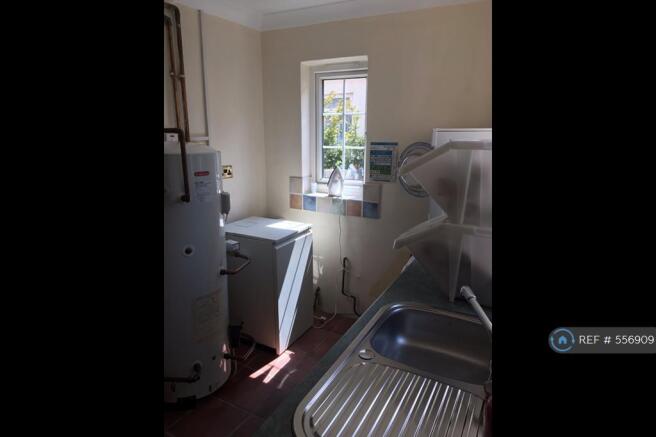 Utility Room With Appliances Provided