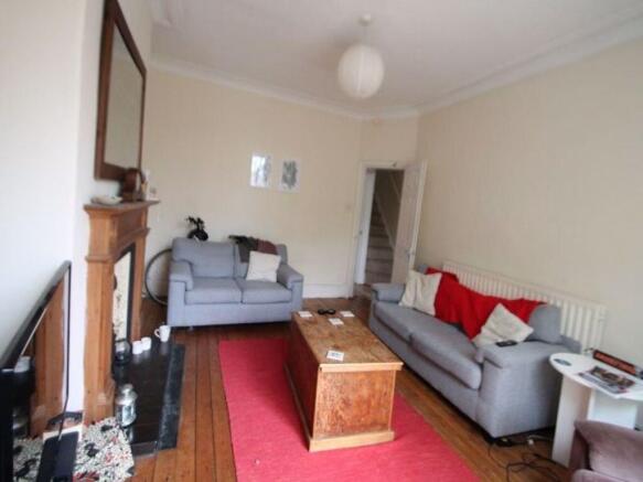 A spacious and inviting living room featuring t...