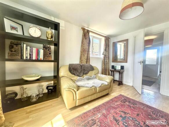 Bright and cozy lounge with stylish wood floors...