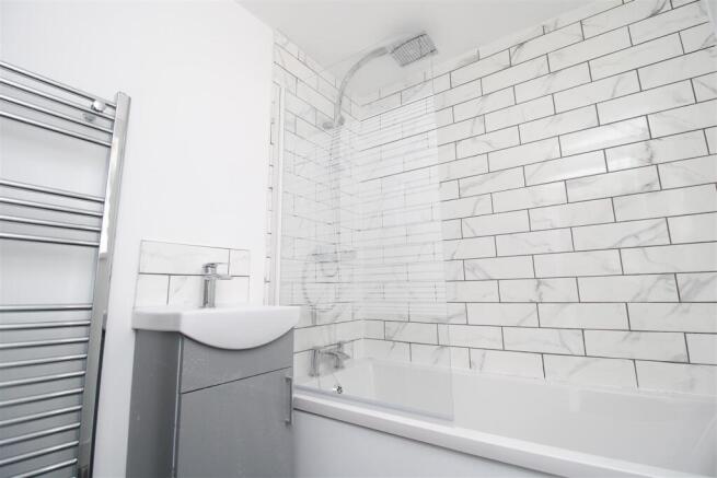 Modern bathroom with subway tiles and full bath...