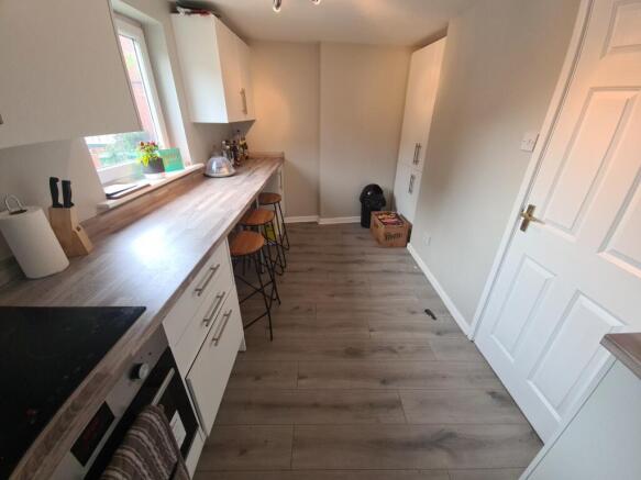 Bright and modern kitchen space featuring ample...