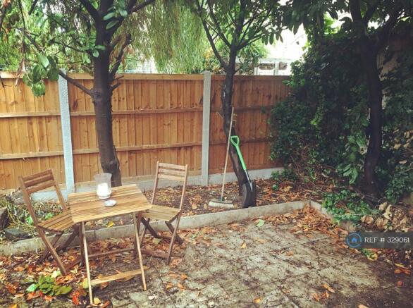 Seating / Bbq Area At Back Of The Enclosed Garden