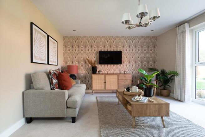 The living room features double doors to the rear garden