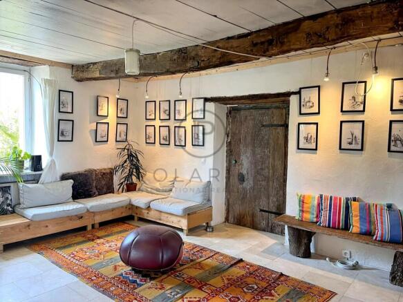 Charming living room with rustic wooden beam and e