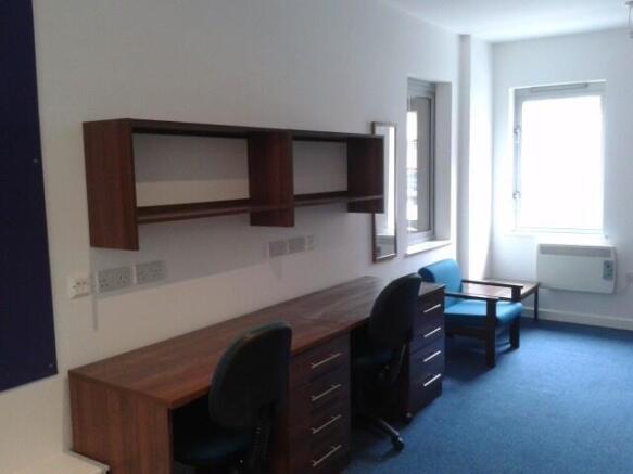 Bright study area with desks and seating...