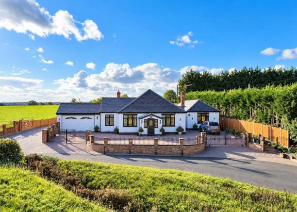 Countryside Bungalow with Wrought-Iron Gates.jpg
