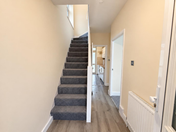 Bright Neutral Hallway with Grey Staircase.png