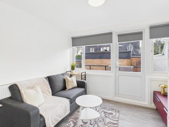 Bright, modern living room with a comfortable d...