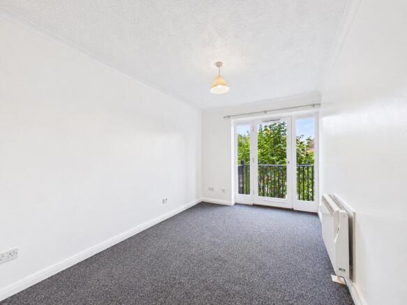 Bright Minimalist Room with Balcony Doors