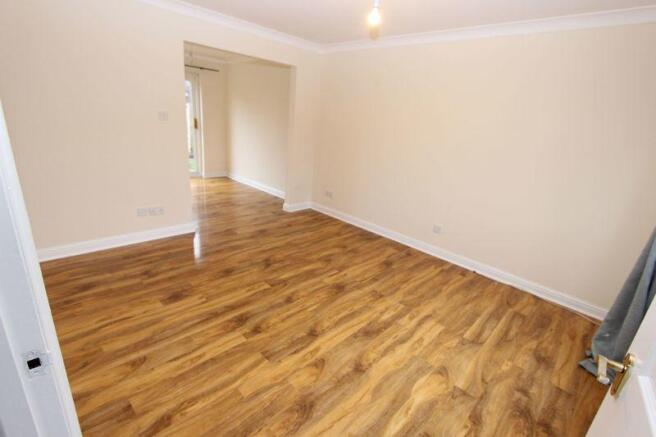 Lounge with dining room in background