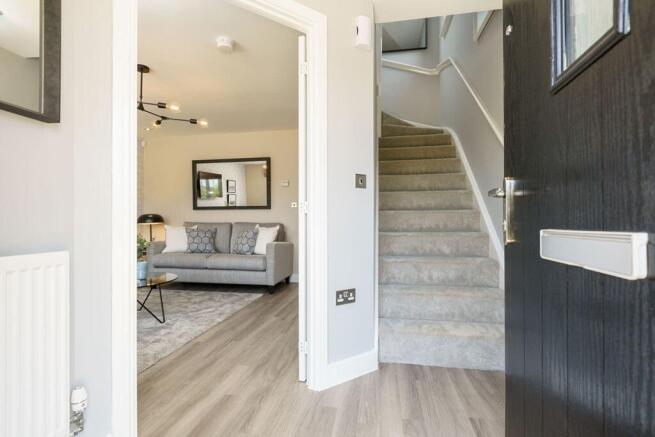 The entrance hallway leads to the lounge