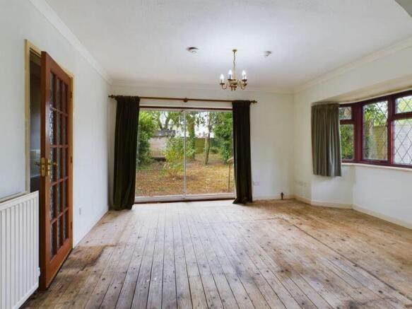 Dining area with sliding doors to rea...