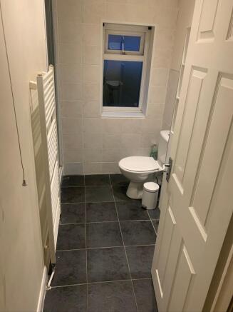 A tidy bathroom featuring modern fixtures and a...