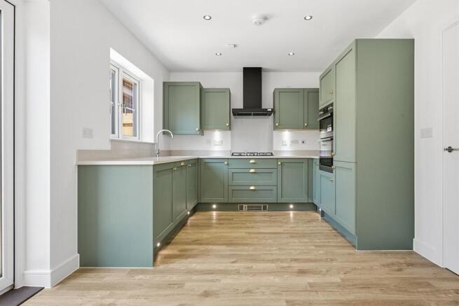 This home comes complete with stylish green cabinets