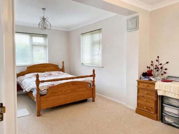 Spacious master bedroom with great natural ligh...