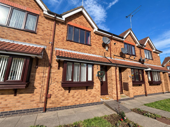 Sunlit Brick Terraced Homes.png