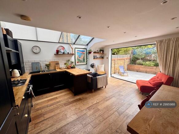 Kitchen And Entertainment Area