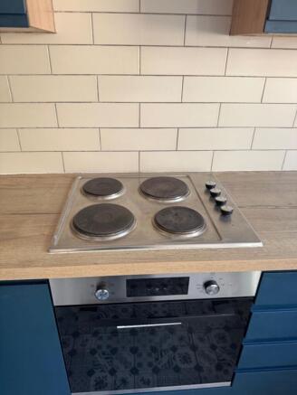 Modern cooking area with sleek subway tiles...