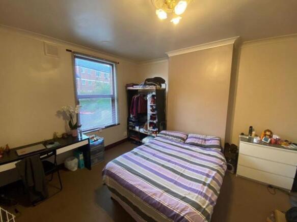 A cozy double bedroom featuring a comfortable d...