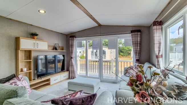 Bright lounge with patio doors in the ABI Amberley