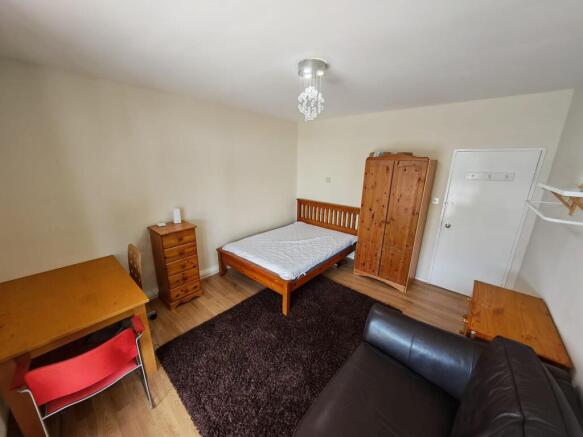 Spacious bedroom with double bed and desk space...