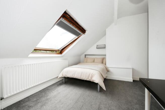 Bright, neatly presented attic bedroom with a c...