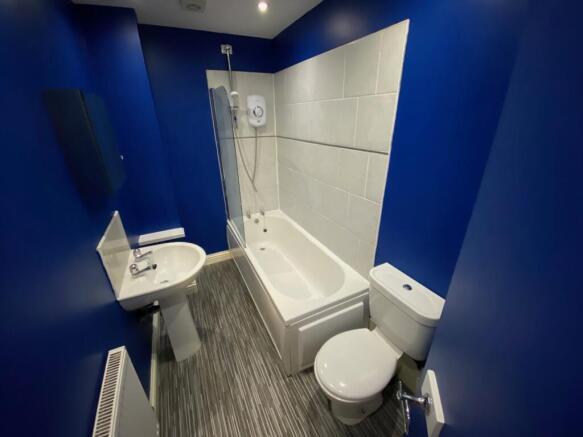 A modern and clean bathroom featuring a bath an...