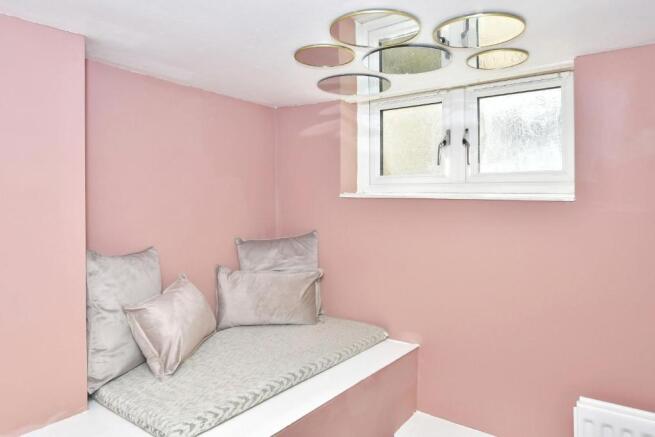 Cozy tucked-in sleeping nook with a cushioned b...