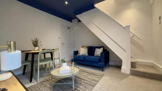 A stylish and inviting living room with modern ...