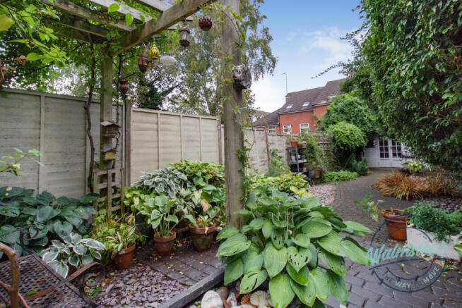 Patio & gardens with summer house