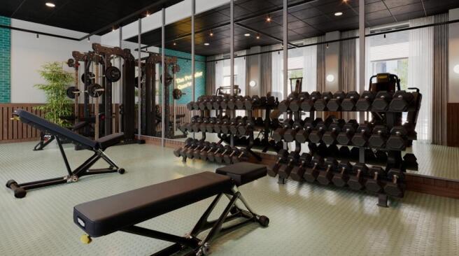 Modern on-site gym with adjustable benches, a f...